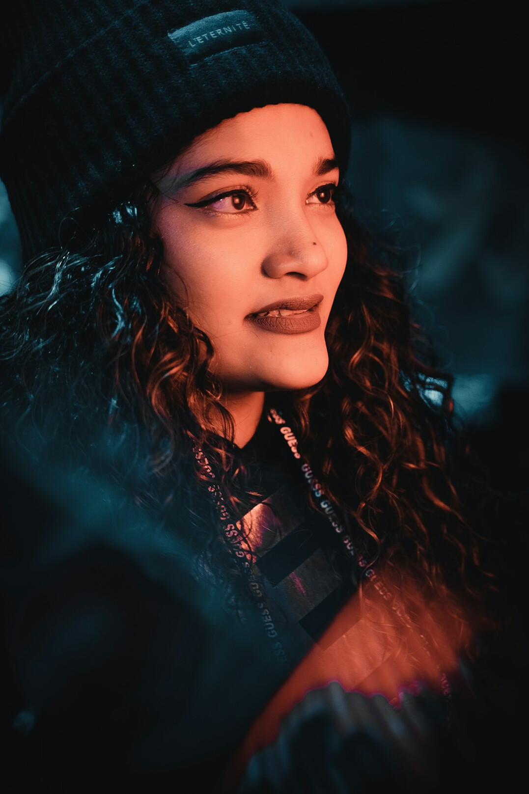 Portrait of a smiling young woman with curly hair